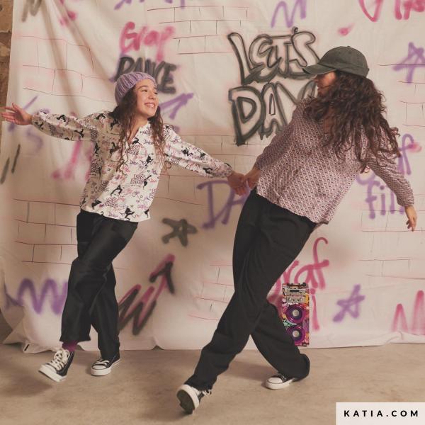 Baumwolljersey mit Let´s Dance Motiven in Rosa/Lila/Schwarz auf Weiß